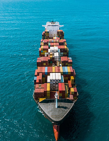 Container ship navigating with full of containers on it